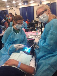 Dr Heidi and Breanna are having a great day providing free dental care at mission of mercy in Green Bay on June 27, 2014. (Photo from: WDA/Facebook). Dr Heidi and Breanna are having a great day providing free dental care at mission of mercy in Green Bay on June 27, 2014. (Photo from: WDA/Facebook).