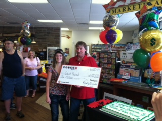 Dave Resnick and daugher accept check Dave Resnick and daugher accept check
