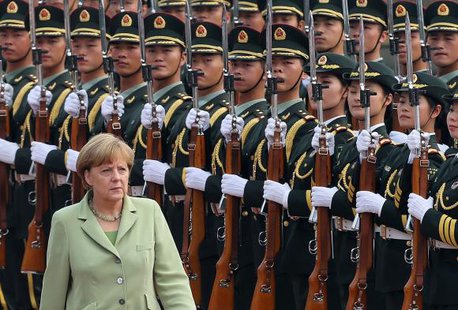 Germany's Chancellor Angela Merkel reviews an honour guard during a welcoming ceremony outside the Great Hall of the People in Beijing July 7, 2014.
CREDIT: REUTERS/KIM KYUNG-HOON (CHINA - TAGS: POLITICS) Germany's Chancellor Angela Merkel reviews an honour guard during a welcoming ceremony outside the Great Hall of the People in Beijing July 7, 2014.
CREDIT: REUTERS/KIM KYUNG-HOON (CHINA - TAGS: POLITICS)