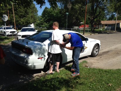 Photo 1 is ISP Trooper Adam Edwards with Shawn Ash in custody. Photo 1 is ISP Trooper Adam Edwards with Shawn Ash in custody.