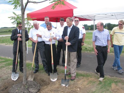 Stevens Point and Canadian National Railroad officials plant the first tree as part of a CN grant program Stevens Point and Canadian National Railroad officials plant the first tree as part of a CN grant program