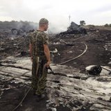 An armed pro-Russian separatist stands at a site of a Malaysia Airlines Boeing 777 plane crash in the settlement of Grabovo in the Donetsk region, Ukraine July 17, 2014. Credit: Reuters/Maxim Zmeyev An armed pro-Russian separatist stands at a site of a Malaysia Airlines Boeing 777 plane crash in the settlement of Grabovo in the Donetsk region, Ukraine July 17, 2014. Credit: Reuters/Maxim Zmeyev