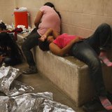 Immigrants who have been caught crossing the border illegally are housed inside the McAllen Border Patrol Station in McAllen, Texas July 15, 2014, where they are processed.
CREDIT: REUTERS/ RICK LOOMIS/POOL Immigrants who have been caught crossing the border illegally are housed inside the McAllen Border Patrol Station in McAllen, Texas July 15, 2014, where they are processed.
CREDIT: REUTERS/ RICK LOOMIS/POOL