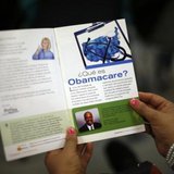 A woman reads a pamphlet in Spanish at a health insurance enrollment event in Cudahy, California March 27, 2014.
CREDIT: REUTERS/LUCY NICHOLSON A woman reads a pamphlet in Spanish at a health insurance enrollment event in Cudahy, California March 27, 2014.
CREDIT: REUTERS/LUCY NICHOLSON