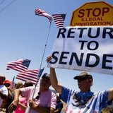 Demonstrators picket against the possible arrivals of undocumented migrants who may be processed at the Murrieta Border Patrol Station in Murrieta, California July 1, 2014. CREDIT: REUTERS/SAM HODGSON