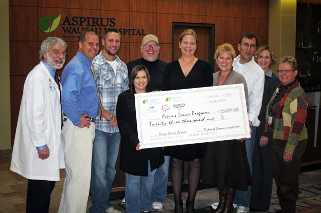 Aspirus and WIFC holding the proceeds check