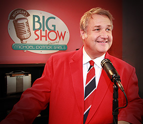 Michael Patrick Shiels Smiling Near Microphone
